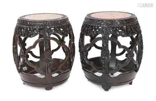 A near pair of Chinese hongmu and rouge marble inset stools,...