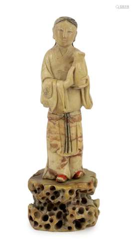 A Chinese soapstone figure of an attendant, 18th century, mi...