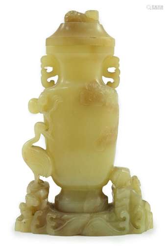 A Chinese yellow and russet jade vase and cover, 19th/20th c...