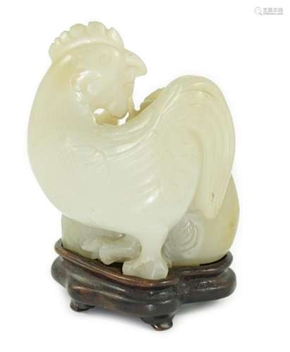 A Chinese pale celadon jade chicken group, 19th century, sma...