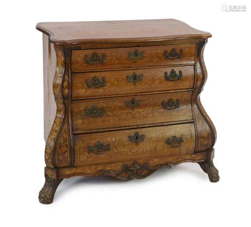 An early 19th century Dutch walnut and marquetry bombé front...