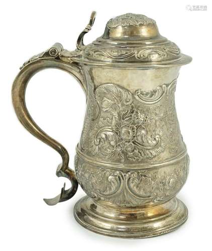 A George II silver baluster tankard, with later embossed dec...