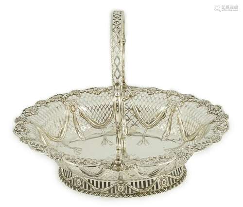 A George III pierced silver oval bread basket, by Charles Al...