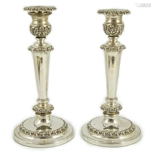 A pair of George III silver candlesticks by John & Thoma...