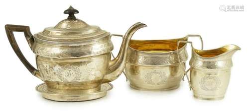 A George III Scottish chased silver oval three piece tea set...