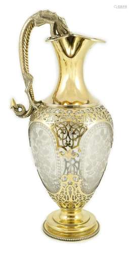 A good Victorian silver gilt mounted etched glass claret jug...