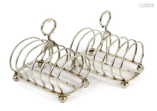 A pair of late Victorian silver seven bar toast racks by Joh...