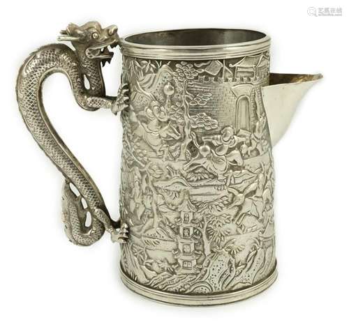 A Chinese embossed white metal mug, now converted to a jug, ...