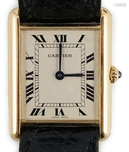 A gentleman's 18ct gold Cartier Tank quartz wrist watch,...