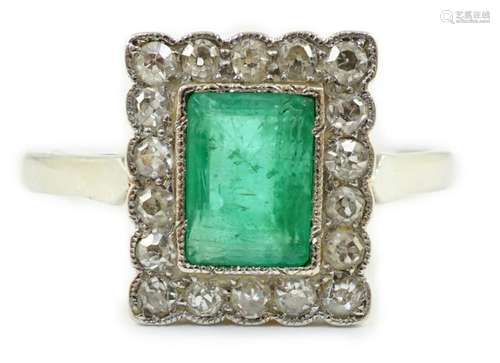 A 1920's 18ct white gold and platinum, emerald and mille...