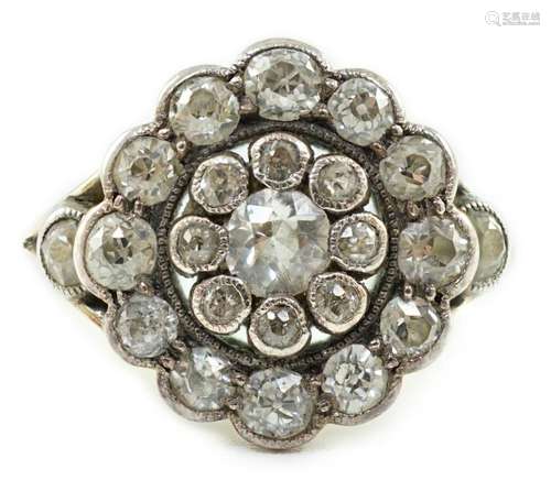 A mid 20th century gold and millegrain set diamond cluster t...