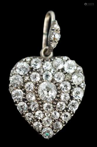 An early 20th century white gold and pave set diamond heart ...