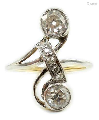 An early to mid 20th century gold and two stone diamond cros...