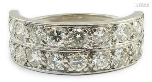 A white gold and two row twenty stone diamond set half etern...