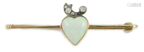 An early 20th century gold, heart shaped white opal and six ...