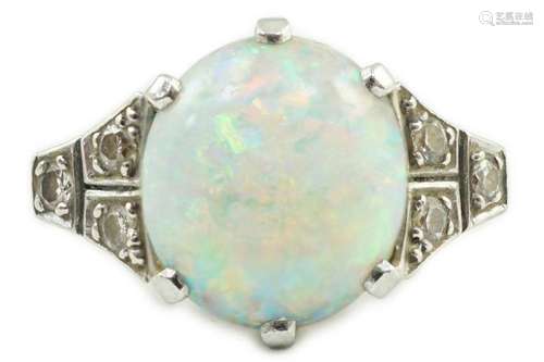 An 18ct white gold, platinum and single stone white opal set...