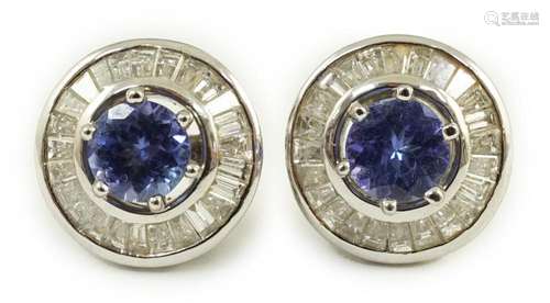 A modern pair of 750 white gold, tanzanite and diamond clust...