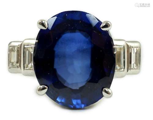 A platinum and single stone oval cut sapphire set cocktail r...