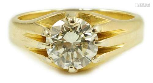 A modern 18ct gold and claw set solitaire diamond ring