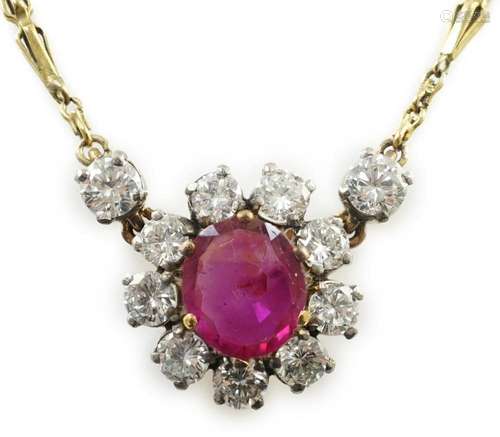 A modern 9ct gold, single stone oval cut ruby and eleven sto...