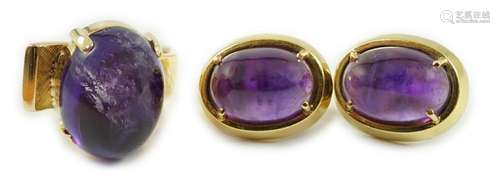 A modern gold and cabochon oval amethyst set dress ring and ...