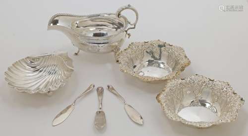 A small group of silver, comprising: a Victorian sauce boat,...