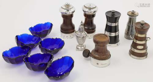 A group of pepper mills, including: an ebony and silver moun...