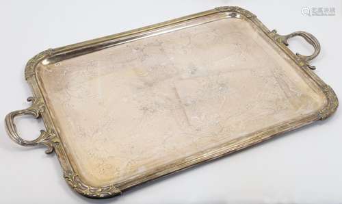 A large silver plated tray, with twin foliate handles, the c...