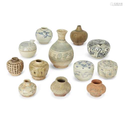 A group of twelve Annamese and Thai small jars and boxes and...