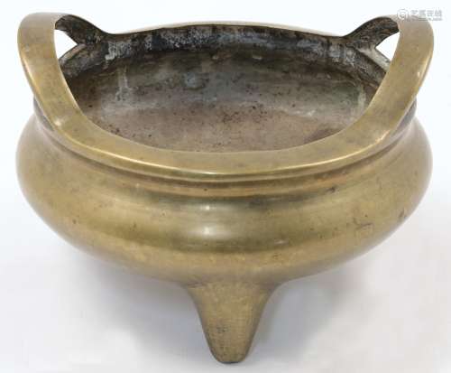 A Chinese bronze censer, early 20th century, cast in circula...