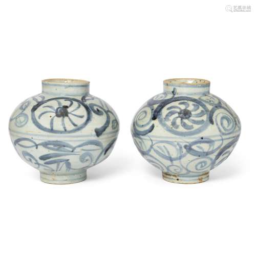 An associated pair of Chinese provincial blue and white vase...