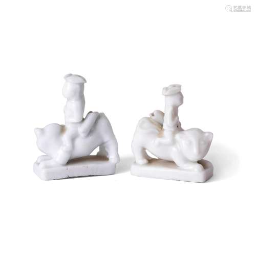 A near pair of Chinese blanc-de-chine figurative whistles, Q...