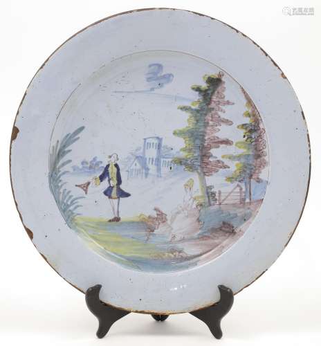 A large delftware plate, possibly Liverpool, 18th century, d...