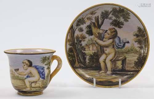 An Italian Majolica cup and saucer, 20th century, decorated ...