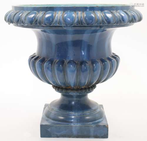A teal glazed pottery urn in the style of Burmantofts Potter...