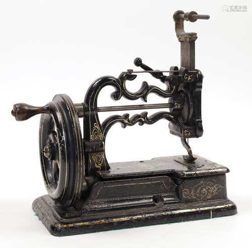 A Charles Raymond chain-stitch sewing machine, c.1871, with ...