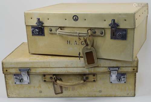 Six vellum suitcases, 20th century, of various sizes, some b...