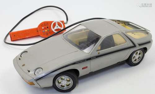 An electronic remote controlled Porsche 928 toy car manufact...