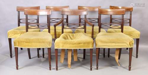 A set of seven George III inlaid mahogany dining chairs, fir...