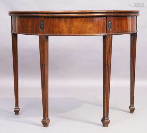 A George III mahogany demi lune tea table, last quarter 18th...