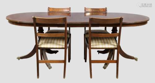 An English brass inlaid mahogany dining table and four chair...