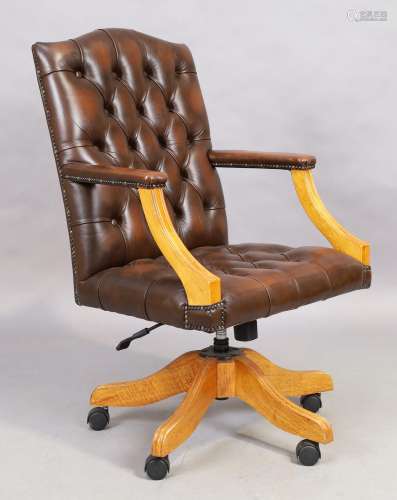 A brown leather desk chair, in the George III style, 21st ce...