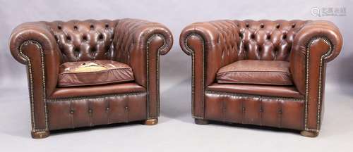 A pair of chesterfield brown leather armchairs, 20th century...