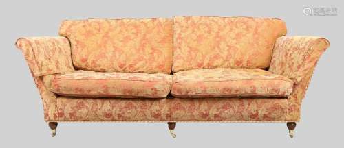 A modern three seat sofa, possibly by Duresta, with red and ...