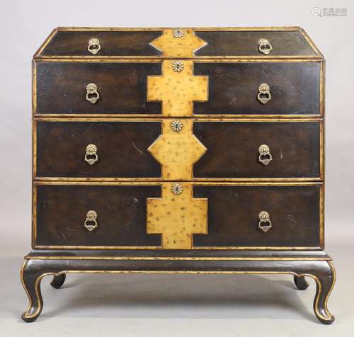 John Richard, an Italian ebonised and parcel gilt commode, l...