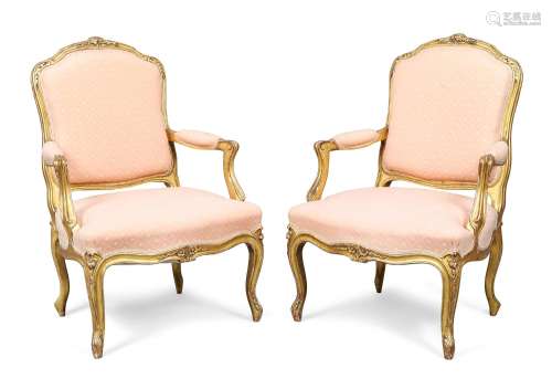 A pair of French carved giltwood fauteuils, in the Louis XV ...