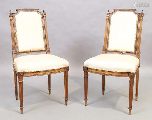 A pair of French walnut side chairs, Louis XVI style, 19th c...