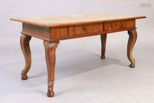 A German walnut table, 19th century, the crossbanded top abo...