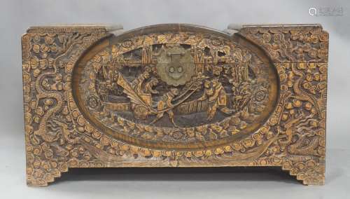 A Chinese camphor wood chest, 20th century, carved with scen...