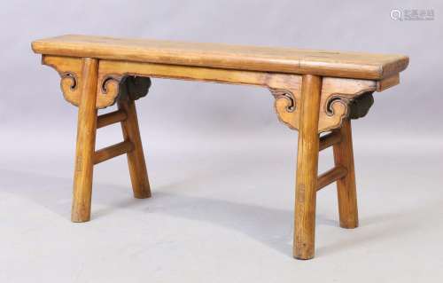 A Chinese elm bench, early 20th century, 51cm high, 110cm wi...